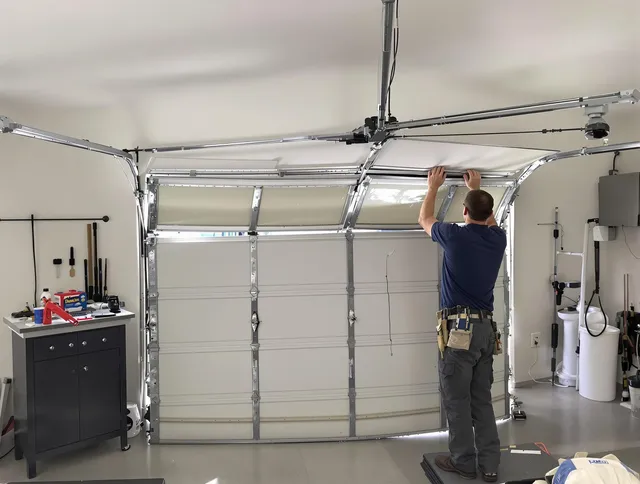 Jerome Garage Door Repair specialist performing precise section replacement on Jerome garage door